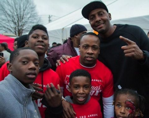 Yo Gotti poses a picture with his kids.